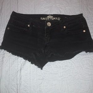 Black frayed denim shorts